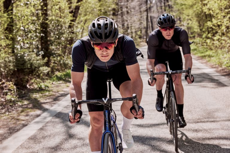 riding on the handlebars of a bike